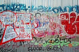 Graffiti on metal panels wall