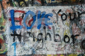 Graffiti painted on a wall with a message of LOVE