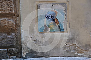 Graffiti painting on wall: modern scene of Jan Vermeer `Girl with pearl earring`