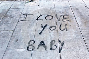 Graffiti on sidewalk I love you baby