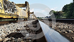 Graffiti on Train Cars on Tracks