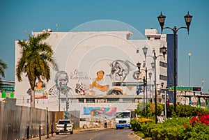 Graffiti on the wall of a building in the city Campeche, drawing portraits of people. San Francisco de Campeche, Mexico.