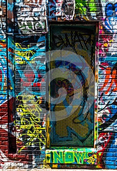 Graffiti on walls and door in Graffiti Alley, Baltimore