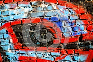Graffitti on an old brick wall