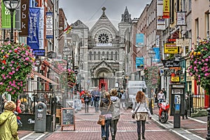 Dublin, Ireland Grafton Street Mall.  Brilliant colors of shoppers and shops highlight this photo.