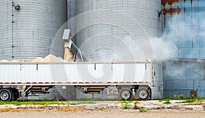 Grain Being Loaded From Silo Into Semi Truck