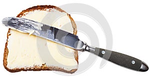 Grain bread and butter sandwich with table knife