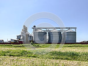 Grain elevator against clear blue sky background