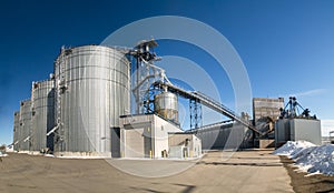 Grain elevators at a shipping port photo