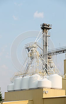 Grain Elevators and storage granaries on top of a facility that produces grain seeds.