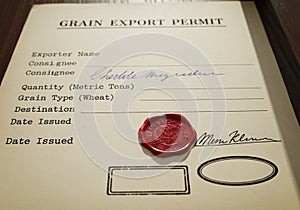 Grain export permit document featuring fields for exporter name, consignee, quantity in metric