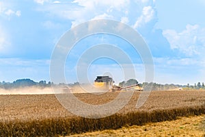 Grain harvesting equipment in the field. Harvest time. Agricultural sector