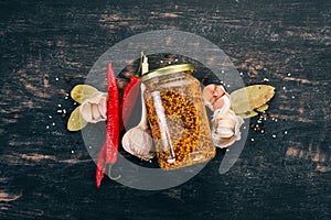 Grain Mustard. Spices On a white wooden background.