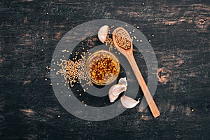 Grain Mustard. Spices On a white wooden background.