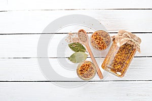 Grain Mustard. Spices On a white wooden background.