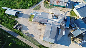 Grain silos, griding machines, warehouses, storage tanks of large feed and fertilizer mill, agro processing plant in Mountain photo