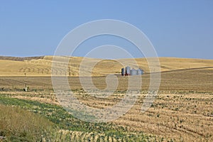 Grain Silos In Harvested Autumn Fields