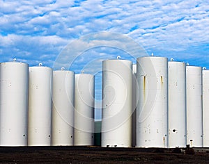 Grain Silos in Southeastern Washington under a blue sky with clouds