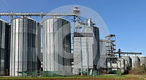 Grain storage bins with silos and elevator tower in the countryside