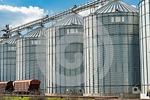 Grain storage. Modern steel agricultural grain granary silos. Agribusiness. photo