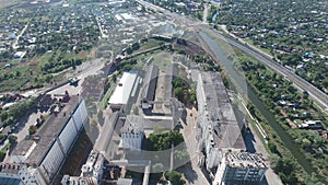 Grain terminal. The old Soviet grain elevator. Top view of a silo elevator. Aerophotographing industrial object.