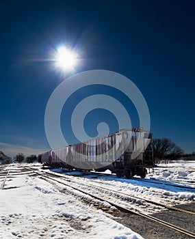 Grain Train Car with sun background.