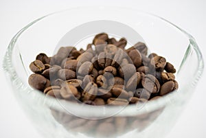 Grains of coffee in a glass bowl