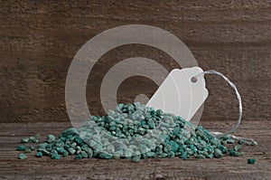 Grains of npk chemical fertilizer on a wooden table