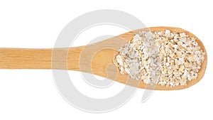 Grains over wooden bamboo spoon. Isolated, White background.