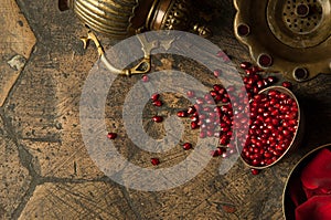 Grains of pomegranate on old paving stones