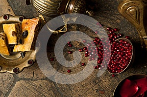 Grains of pomegranate on old paving stones