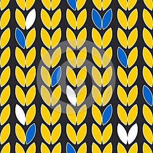 Grains of rice or wheat on a black background. Seamless cute pattern with yellow and blue leaves.