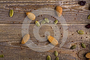 grains, seeds, and the seeds scattered on wooden background. photo