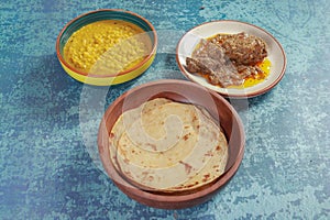 Gram pulses dal or yellow dal, chicken chap with parathas