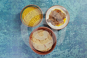 Gram pulses dal or yellow dal, chicken chap with parathas