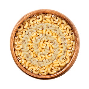 Gramigna, minute pasta, pastina for soups, in a wooden bowl photo