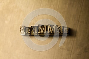 GRAMMAR - close-up of grungy vintage typeset word on metal backdrop