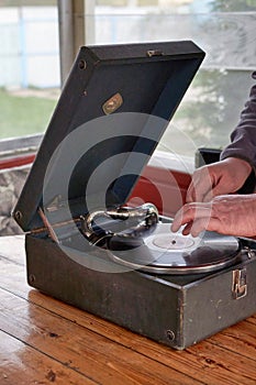 The gramophone record is played on the old potiphon