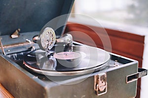 The gramophone record is played on the old potiphon