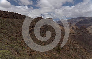 Gran Canaria, landscape of the southern part of the island along Barranco de ArguineguÃÂ­n steep and deep ravine photo