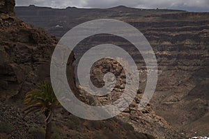 Gran Canaria, landscape of the southern part of the island along Barranco de ArguineguÃÂ­n steep and deep ravine photo