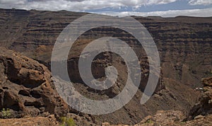 Gran Canaria, landscape of the southern part of the island along Barranco de ArguineguÃÂ­n steep and deep ravine photo