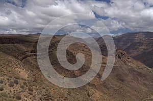 Gran Canaria, landscape of the southern part of the island along Barranco de ArguineguÃÂ­n steep and deep ravine photo