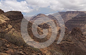 Gran Canaria, landscape of the southern part of the island along Barranco de ArguineguÃÂ­n steep and deep ravine photo