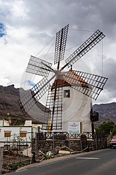 Gran Canaria, Spain - Feb 21, 2023: Traditional old wind mill Molino de Viento near Mogan, Gran Canaria island, Spain