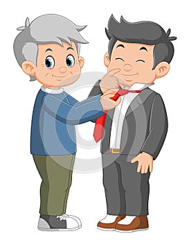 a gran father helping his Adult Son with put on a necktie