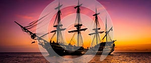 gran fragata pirata en el atardecer photo