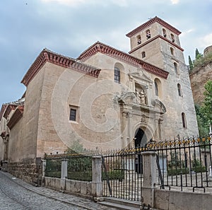 View at the San Pedro and San Pablo Church, Mudejar and Renaissance styles, on Carrera del Darro to the street sad walk in Granada photo