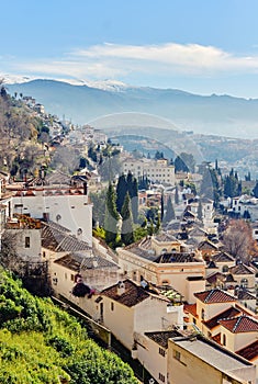 Granada town and snowy mountains of Sierra Nevada. Spain