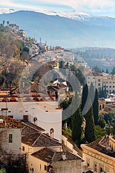 Granada town and snowy mountains of Sierra Nevada. Spain